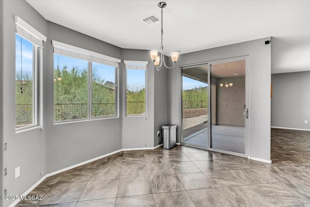 3156 S Three D Ct, Tucson, AZ 85713 - unfurnished dining area featuring a chandelier and baseboards