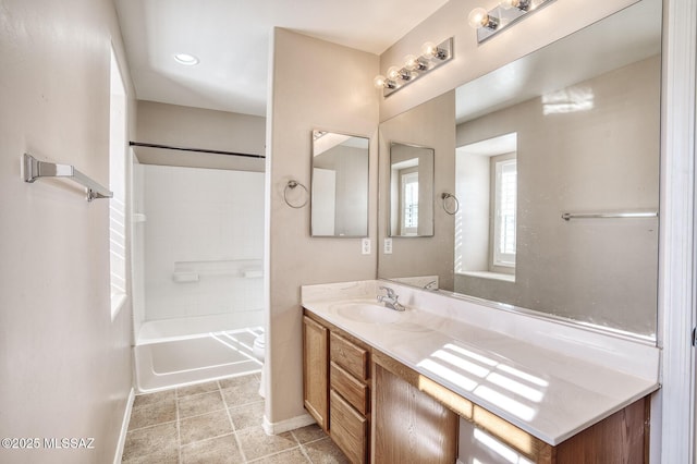 full bath featuring baseboards, shower / tub combination, and vanity