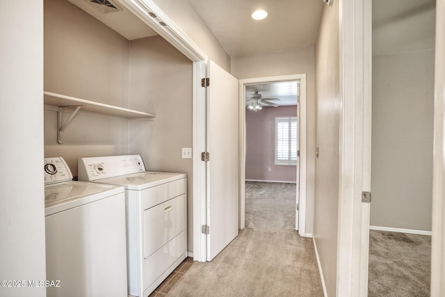 washroom featuring laundry area, light carpet, baseboards, visible vents, and washer and clothes dryer