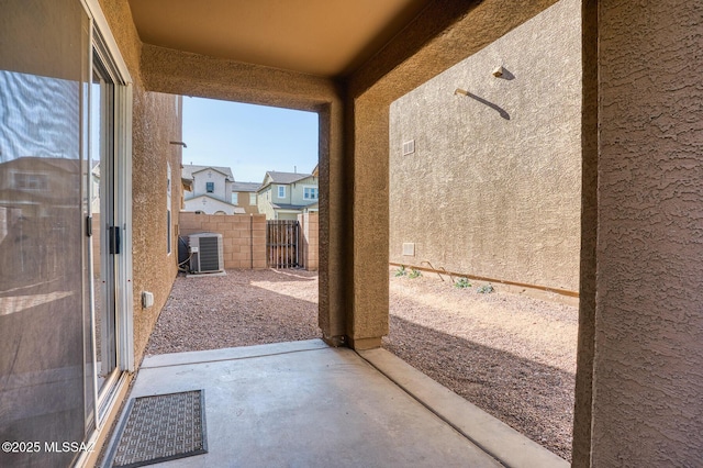 view of patio / terrace with fence and central AC unit
