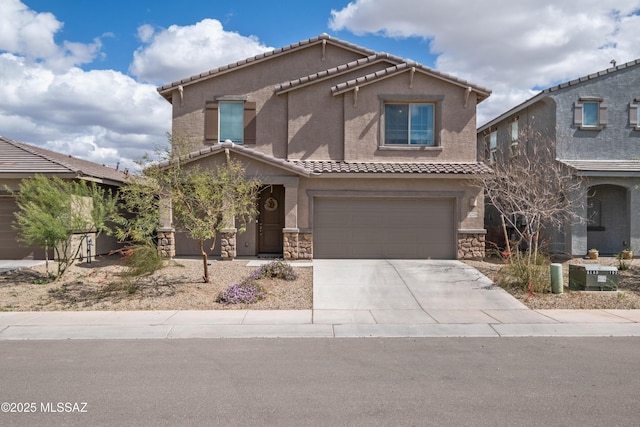 view of front of property featuring a tile roof, stucco siding, stone siding, concrete driveway, and an attached garage