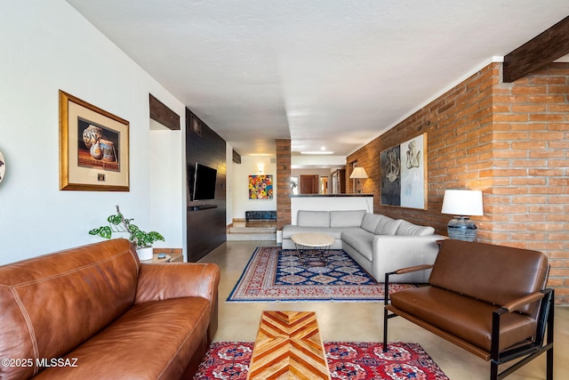 living area with brick wall