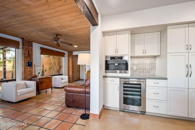 bar with backsplash, a ceiling fan, wood ceiling, and wine cooler