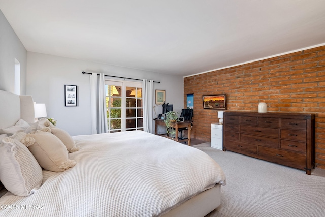 carpeted bedroom with brick wall