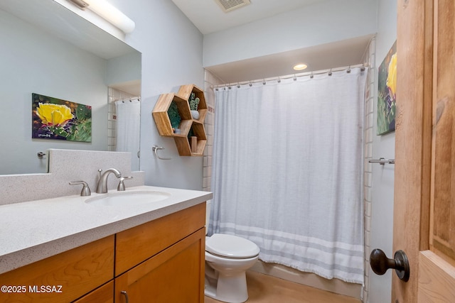 full bathroom with visible vents, shower / tub combo with curtain, toilet, and vanity