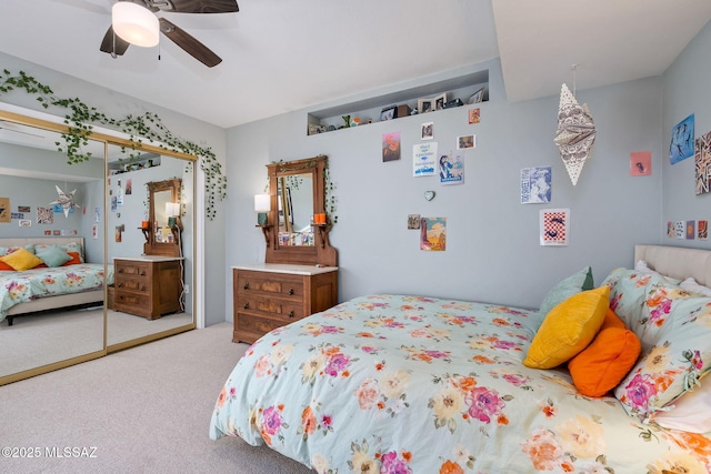 bedroom featuring carpet flooring, ceiling fan, and a closet
