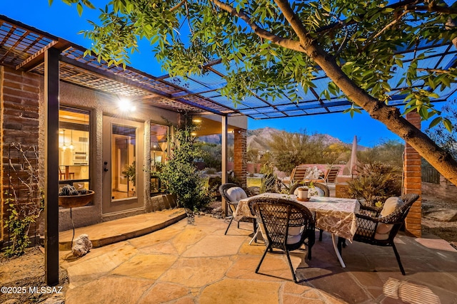 view of patio featuring a pergola and outdoor dining area
