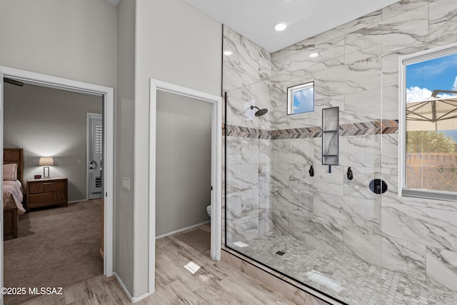full bathroom featuring connected bathroom, toilet, baseboards, and a walk in shower