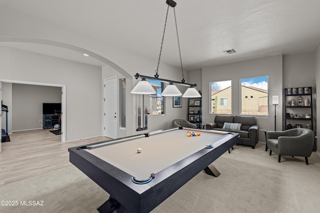 playroom with visible vents, light carpet, arched walkways, billiards, and baseboards