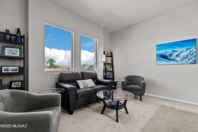 living room with light carpet and baseboards