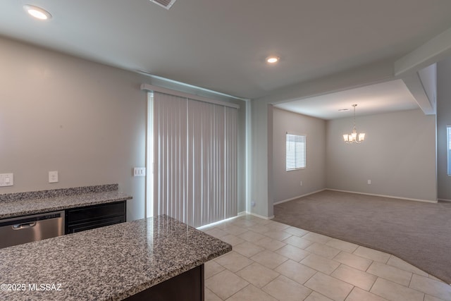 kitchen with stainless steel dishwasher, baseboards, light colored carpet, recessed lighting, and a notable chandelier