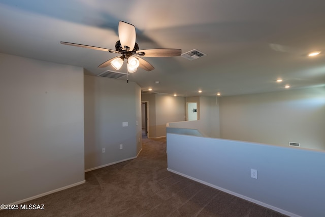 carpeted spare room featuring recessed lighting, ceiling fan, and visible vents