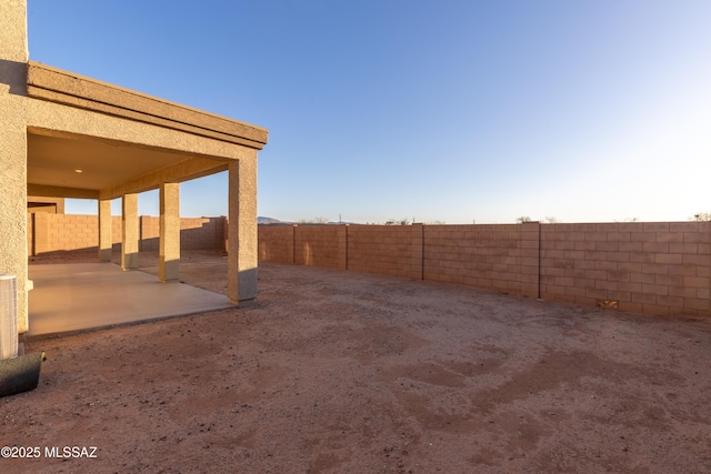 view of yard with a patio and a fenced backyard
