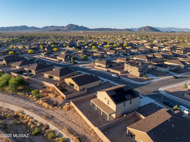 drone / aerial view featuring a mountain view and a residential view