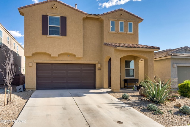 894 E Prairie Field Ln, Sahuarita, AZ 85629 - mediterranean / spanish-style home featuring a tiled roof, stucco siding, an attached garage, and driveway