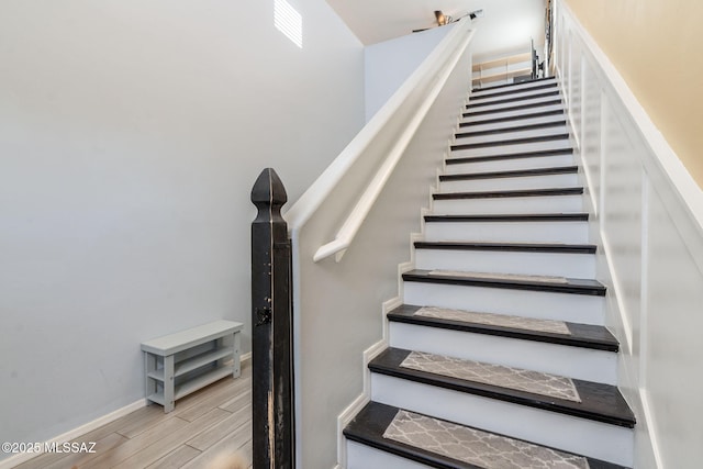 894 E Prairie Field Ln, Sahuarita, AZ 85629 - stairs with wood finished floors and baseboards