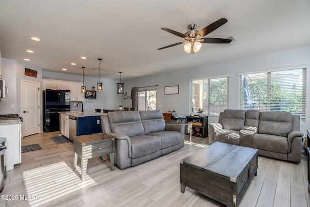 894 E Prairie Field Ln, Sahuarita, AZ 85629 - living area featuring light wood-style floors, ceiling fan, and recessed lighting