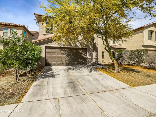 11155 E Vail Vista Ct, Tucson, AZ 85747 - view of property hidden behind natural elements with a garage, stucco siding, driveway, and a tiled roof