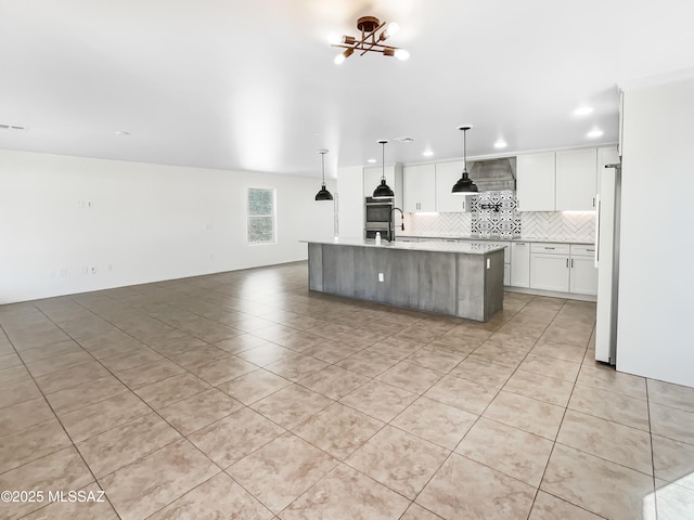 11155 E Vail Vista Ct, Tucson, AZ 85747 - kitchen with light tile patterned floors, white refrigerator, backsplash, light countertops, and open floor plan