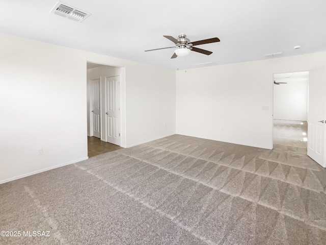 11155 E Vail Vista Ct, Tucson, AZ 85747 - unfurnished room featuring visible vents, a ceiling fan, baseboards, and carpet floors