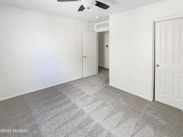 11155 E Vail Vista Ct, Tucson, AZ 85747 - unfurnished bedroom featuring a ceiling fan, visible vents, carpet floors, and baseboards