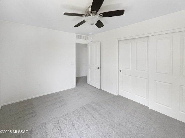 11155 E Vail Vista Ct, Tucson, AZ 85747 - unfurnished bedroom featuring a closet, carpet, ceiling fan, baseboards, and visible vents