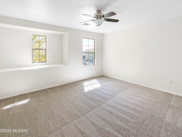 11155 E Vail Vista Ct, Tucson, AZ 85747 - carpeted empty room featuring visible vents, ceiling fan, and baseboards