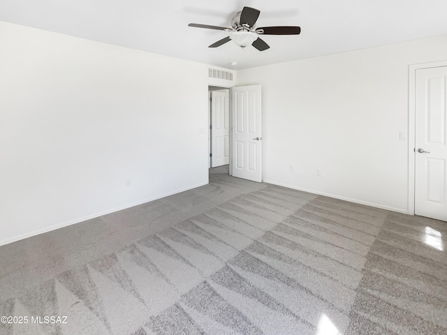 11155 E Vail Vista Ct, Tucson, AZ 85747 - carpeted spare room featuring visible vents, a ceiling fan, and baseboards