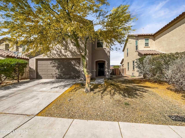 11155 E Vail Vista Ct, Tucson, AZ 85747 - view of front of home featuring stucco siding, a tiled roof, fence, a garage, and driveway