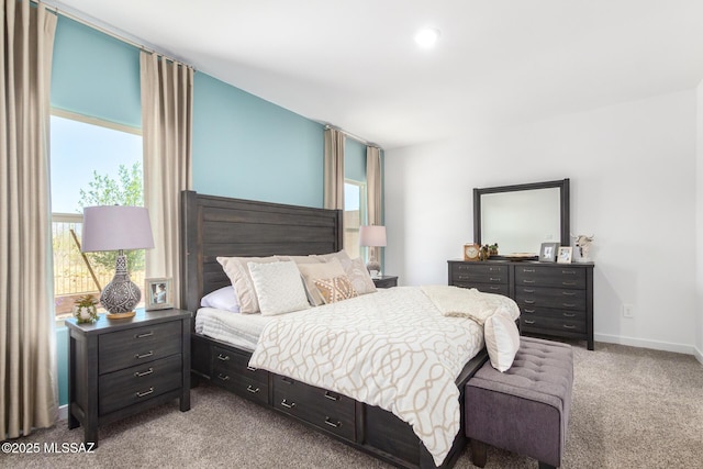 bedroom with baseboards and carpet