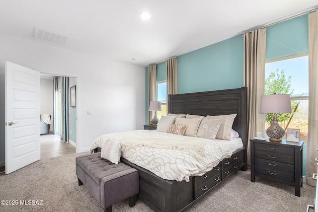 bedroom featuring baseboards, visible vents, light carpet, and recessed lighting