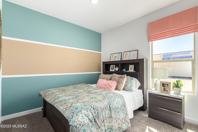 carpeted bedroom with baseboards