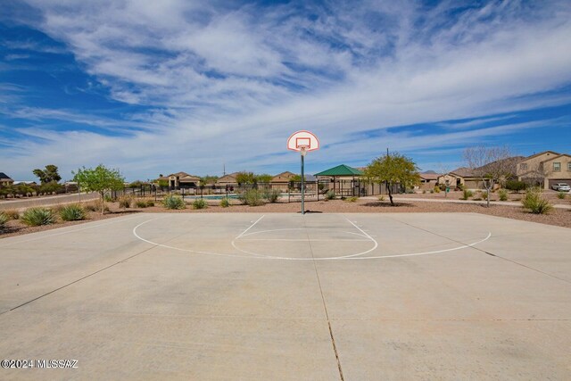 view of sport court with fence, a gazebo, a residential view, and community basketball court