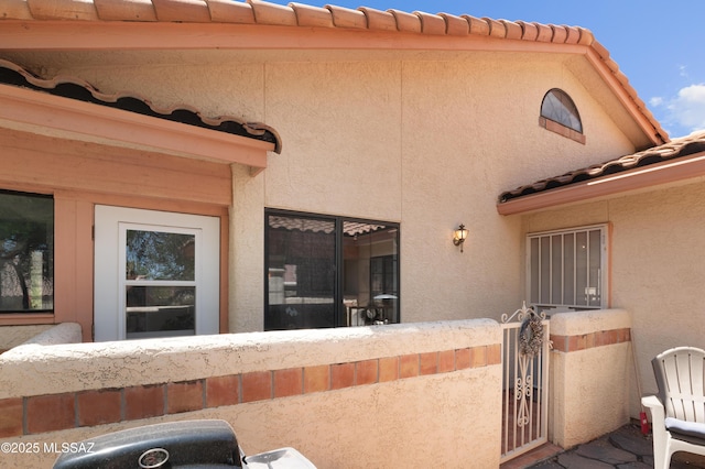 133 E Horizon Cir, Tucson, AZ 85737 - exterior space featuring stucco siding and a tiled roof