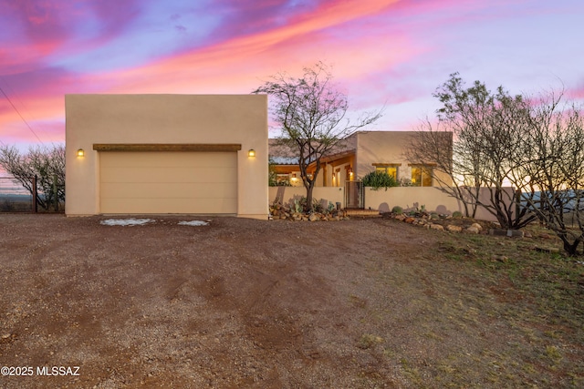 221 Calle Coco, Nogales, AZ 85621 - pueblo-style home featuring stucco siding, fence, and driveway
