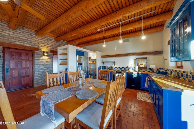 221 Calle Coco, Nogales, AZ 85621 - dining space with wood ceiling, visible vents, beam ceiling, brick wall, and brick floor