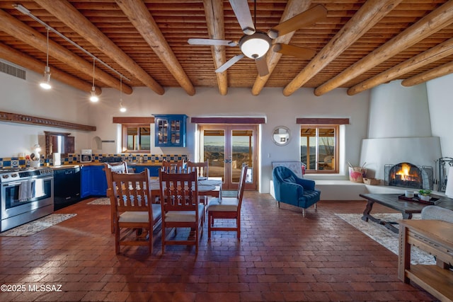 221 Calle Coco, Nogales, AZ 85621 - dining room featuring wood ceiling, a large fireplace, visible vents, ceiling fan, and beam ceiling