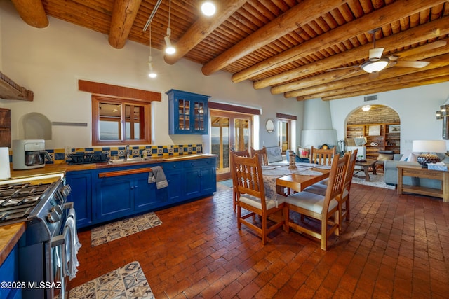 221 Calle Coco, Nogales, AZ 85621 - dining room with arched walkways, wooden ceiling, brick floor, and visible vents