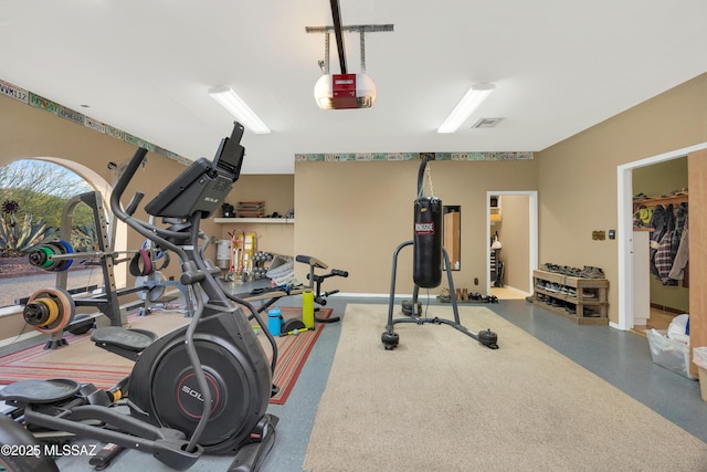 exercise room with baseboards