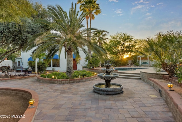 view of property's community with a patio