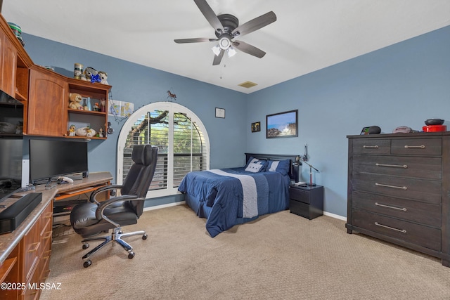 bedroom with baseboards, light carpet, a ceiling fan, and visible vents