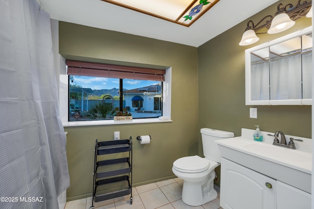 bathroom featuring tile patterned flooring, vanity, toilet, baseboards, and a shower with curtain