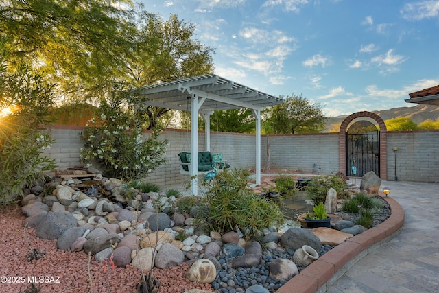 view of patio featuring a pergola and fence private yard