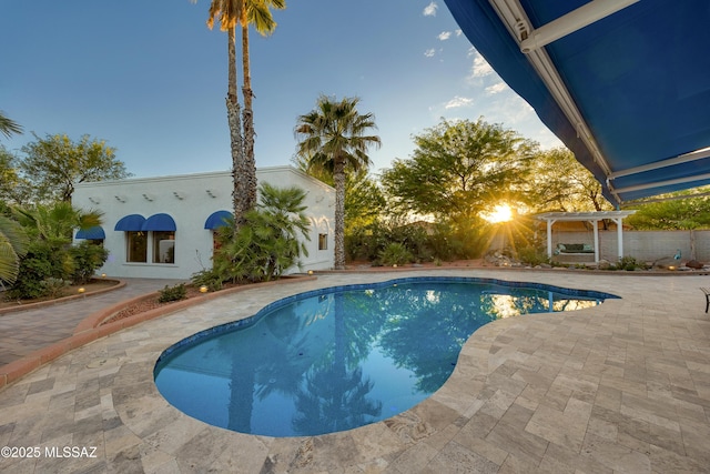 pool featuring a patio and a pergola