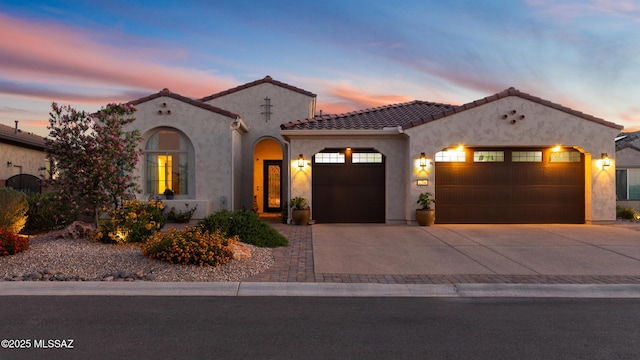 2230 E Thunder Bluff Dr, Green Valley, AZ 85614 - mediterranean / spanish-style home with a garage, concrete driveway, stucco siding, and a tiled roof