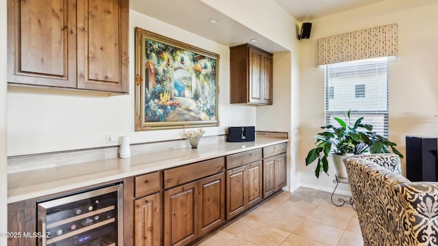 2230 E Thunder Bluff Dr, Green Valley, AZ 85614 - bar featuring beverage cooler, light tile patterned floors, and baseboards