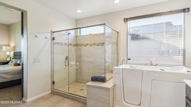 2230 E Thunder Bluff Dr, Green Valley, AZ 85614 - ensuite bathroom with a shower stall, a garden tub, tile patterned flooring, baseboards, and recessed lighting
