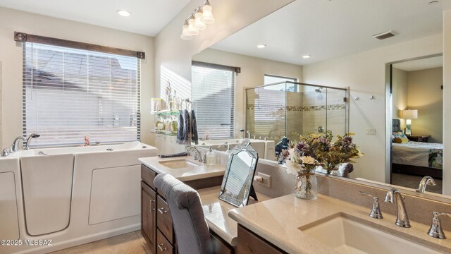 2230 E Thunder Bluff Dr, Green Valley, AZ 85614 - ensuite bathroom with vanity, a stall shower, a garden tub, and recessed lighting