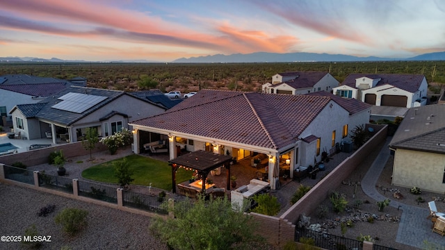 2230 E Thunder Bluff Dr, Green Valley, AZ 85614 - aerial view at dusk of a mountain view and a residential view