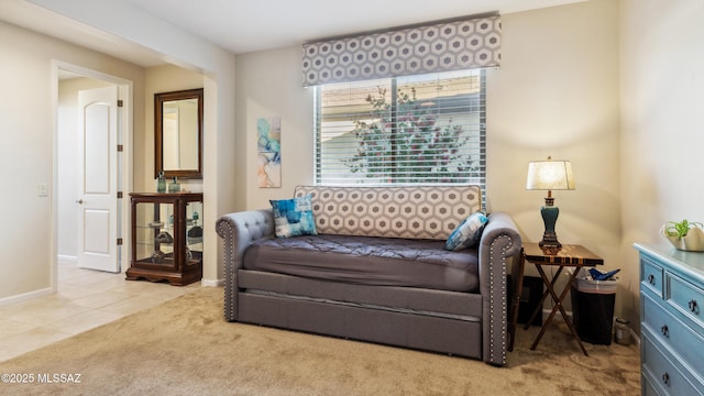 2230 E Thunder Bluff Dr, Green Valley, AZ 85614 - carpeted living area with baseboards and tile patterned flooring